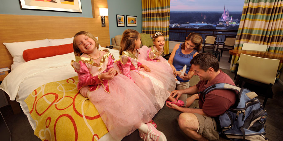 Little Princesses, Bay Lake Tower at Disney's Contemporary Resort Three girls dressed as princesses sitting on a bed at Bay Lake Tower at Disney's Contemporary Resort